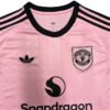 Pink Manchester United third soccer jersey with black accents, Adidas logo, and team crest.