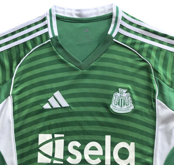 Manchester United third soccer jersey for 2025/26 season, green and white design.