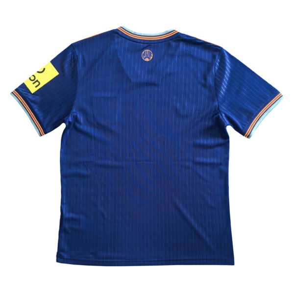Manchester United third soccer jersey for 2025/26 season, blue with orange accents.