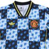 Manchester United third soccer jersey with blue, black, and yellow geometric pattern.