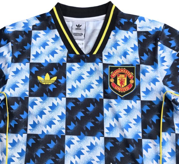 Manchester United third soccer jersey with blue, black, and yellow geometric pattern.
