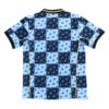 Alternate Manchester United 2025/26 third kit with vibrant blue and black geometric pattern.
