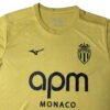 Manchester United third kit 2025/26 with AS Monacofc logo, yellow color, and modern design.