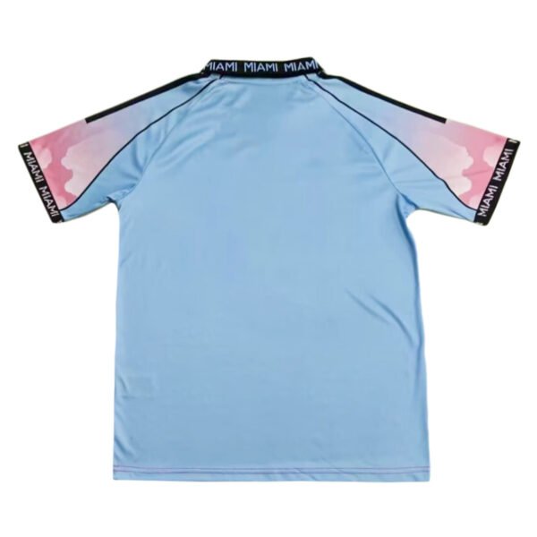 Miami Polo Shirt - 25/26 Bright blue Miami polo shirt with pink and black accents, perfect for sports and casual wear.