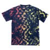 Manchester United third soccer jersey with abstract navy, yellow, and red design.