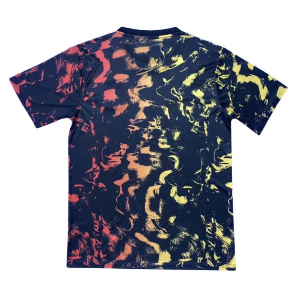 Manchester United third soccer jersey with abstract navy, yellow, and red design.