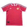 Manchester United third soccer jersey 2025/26 season, red with white accents.