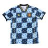 Manchester United third kit 2025/26 with bold blue and black geometric pattern.