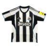 Manchester United third kit 2025/26 with black and white stripes, featuring sponsor logos and team c.