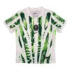 Alternative soccer jersey for Manchester United 2025/26 season with green and white tropical print.