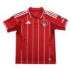 Manchester United third soccer jersey for 2025/26 season, red with white stripes.