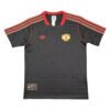 Manchester United third soccer jersey 2025/26, black with red accents, official team kit.