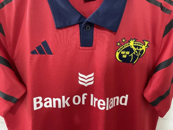 Red rugby jersey featuring Ireland rugby team logo and Bank of Ireland sponsor.
