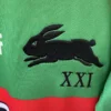 Sportswear with Running Rabbit Logo and Roman Numerals Green sportswear featuring a black running rabbit logo and "XXI" Roman numerals, ideal for athletic.