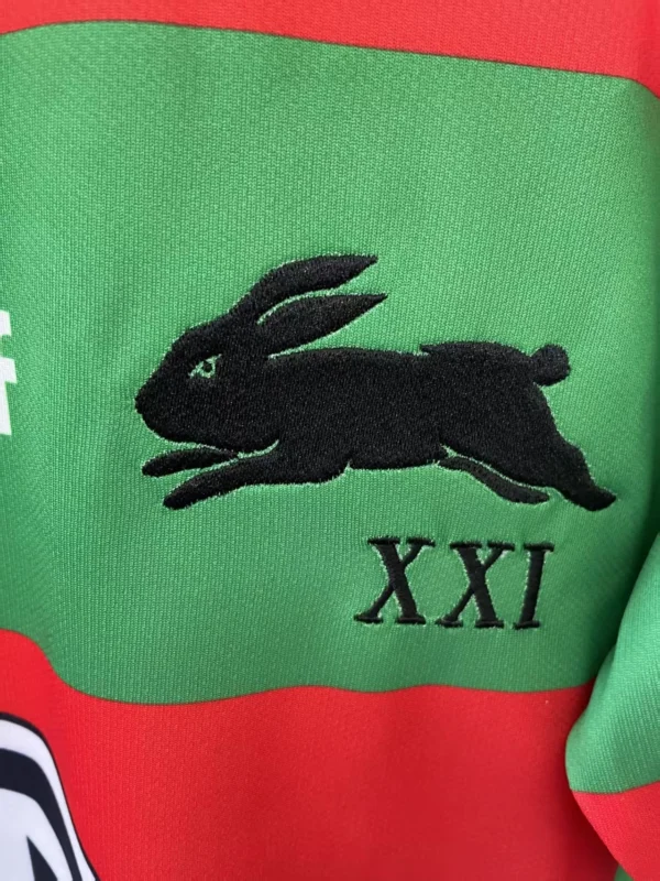 Sportswear with Running Rabbit Logo and Roman Numerals Green sportswear featuring a black running rabbit logo and "XXI" Roman numerals, ideal for athletic.