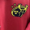 Hunting Rugby logo embroidered on red sports jersey, showcasing team branding and emblem.