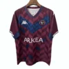 Soccer Jersey with Bordeaux and Blue Design Bordeaux and blue patterned soccer jersey with team logo and sponsor ARKEA.