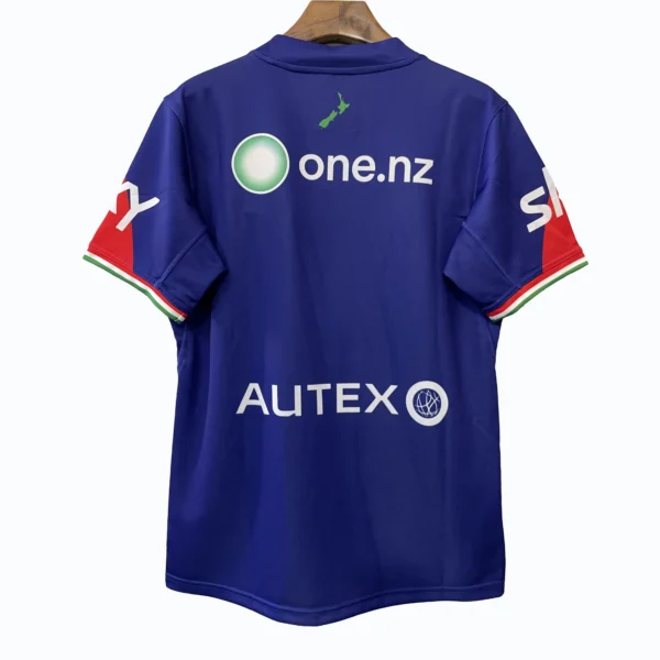 Blue sports jersey featuring New Zealand map and sponsor logos, ideal for athletic wear.