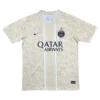 Paris Saint-Germain away football jersey with Qatar Airways sponsor, beige color, and club crest.