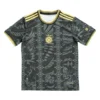 Sports Jersey with Black and Gold Design and Sun Emblem Black and gold sports jersey with sun emblem, intricate patterns, and athletic style.