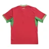 Sports jersey with green accents and gold embroidery, ideal for athletic activities and team sports.