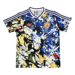 Manchester United Kids' Soccer Jersey Kids' Manchester United soccer jersey with colorful abstract design and team logo.