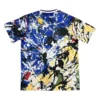Abstract paint splatter sports T-shirt in vibrant blue, yellow, black, and white colors. Perfect for.