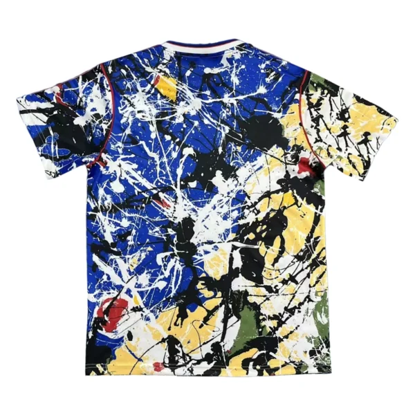 Abstract paint splatter sports T-shirt in vibrant blue, yellow, black, and white colors. Perfect for.