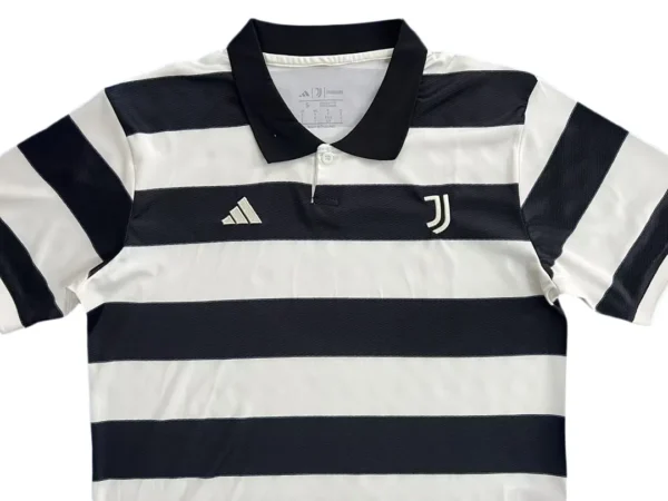 Classic Black and White Striped Soccer Jersey Soccer jersey with bold black and white horizontal stripes, featuring Juventus logo and Adidas emble.