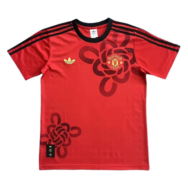 Manchester United Red Football Jersey with Black and Gold Details Manchester United red football jersey with black accents and club crest, ideal for sports fans.