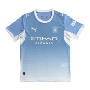 Manchester City FC Home Jersey 2023/24, blue and white football shirt with sponsor logo. Manchester City FC 2023/24 home football jersey, blue with white accents and sponsor logo.