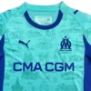 OM Olympique Marseille Home Football Jersey Marseille football jersey with club logo and sponsor, blue and turquoise design.