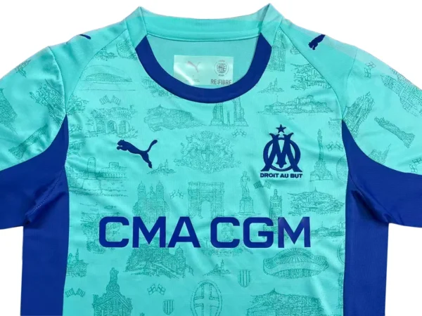 OM Olympique Marseille Home Football Jersey Marseille football jersey with club logo and sponsor, blue and turquoise design.