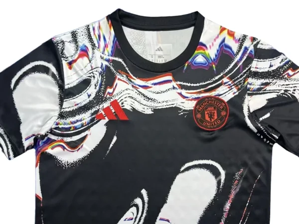 Manchester United soccer jersey with vibrant graphic design and team logo. Perfect for sports fans and athletic wear enthusiasts. 26/27 Manchester United Training Jersey