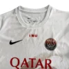 Paris Saint-Germain white soccer jersey with Nike logo, Qatar sponsor, and IWD text, ideal for sport.