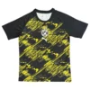 Kids' Borussia Dortmund football jersey with black and yellow abstract design.