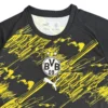 Borussia Dortmund black and yellow football jersey with club logo and Puma branding.