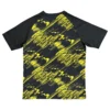 Black and yellow graphic sports T-shirt with dynamic design for activewear.