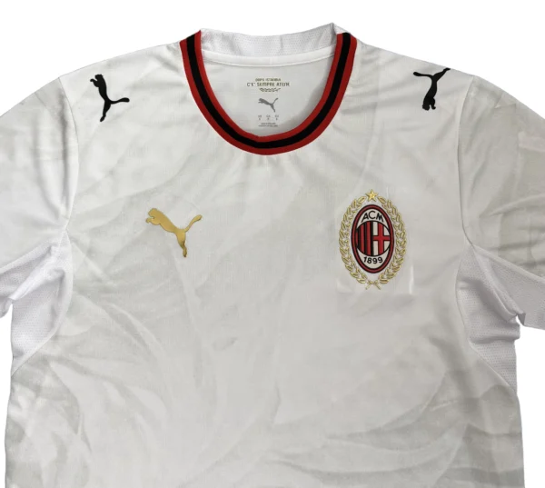 Milan football jersey with Puma logo and club crest, sportswear for soccer fans.