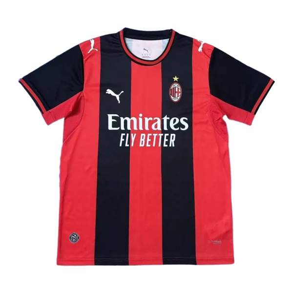 AC Milan official home football jersey with red and black vertical stripes, Puma logo, and club cres.