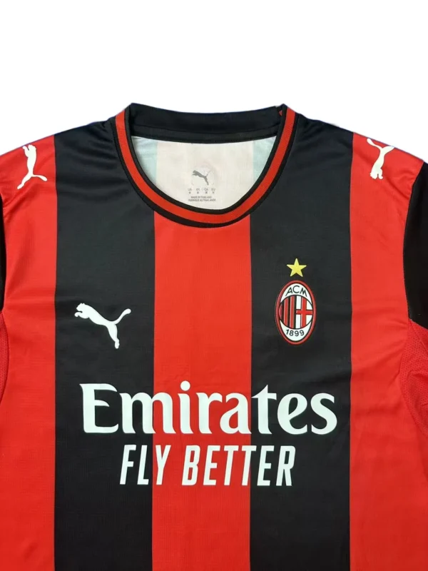 Milan AC soccer jersey featuring Puma logo and Emirates sponsor.