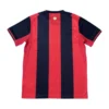 Red and navy striped football jersey for sports and team uniforms.