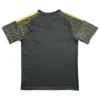 Sports Jersey with Geometric Pattern Design Sports jersey with black base and yellow geometric patterned sleeves.