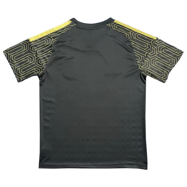Sports Jersey with Geometric Pattern Design Sports jersey with black base and yellow geometric patterned sleeves.