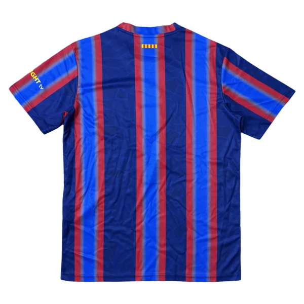 Football Jersey with Blue and Red Stripes Blue and red striped football jersey with team logo and sponsor details.