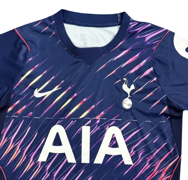 Tottenham Hotspur Football Jersey Tottenham Hotspur soccer jersey with dynamic purple and pink design, Nike logo, and club crest.