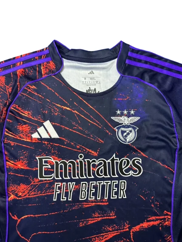Sports jersey with Benfica logo and Adidas branding for football fans Football jersey featuring Benfica emblem, Adidas logo, and vibrant orange and purple design elements.