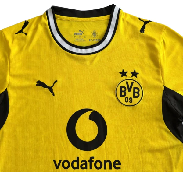 Borussia Dortmund yellow and black football jersey with Vodafone logo.