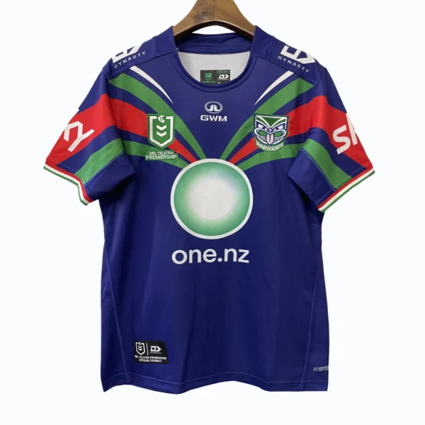 New Zealand Warriors rugby jersey with team logos and sponsor branding.