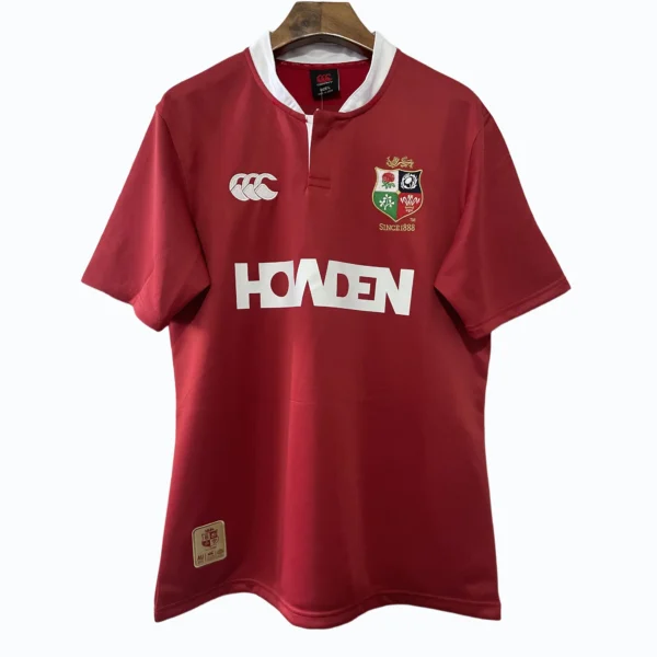 Sports jersey featuring team crest, sponsor logo, and Canterbury branding for athletic performance a.